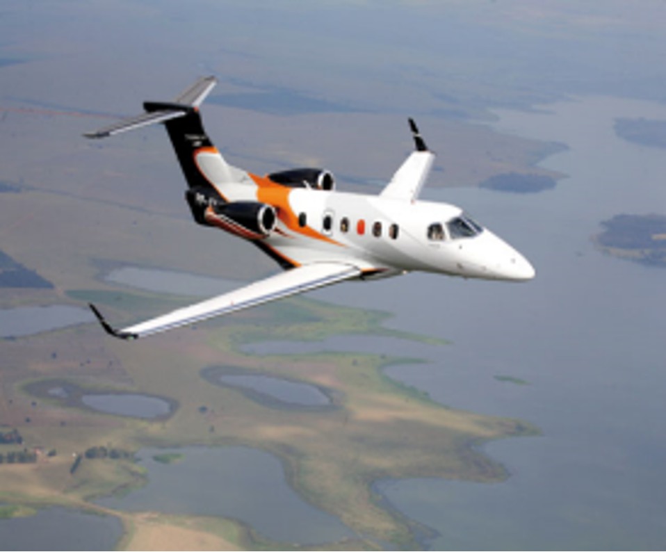 Embraer Phenom 300 aircraft in flight