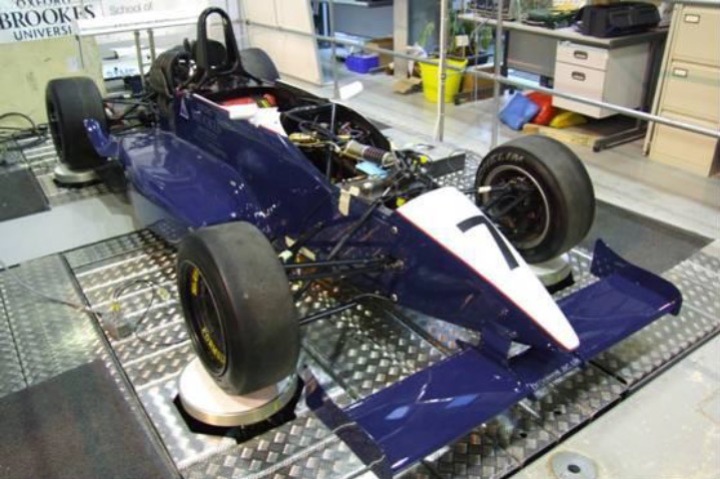 Race car positioned on a laboratory test platform at Oxford Brookes University