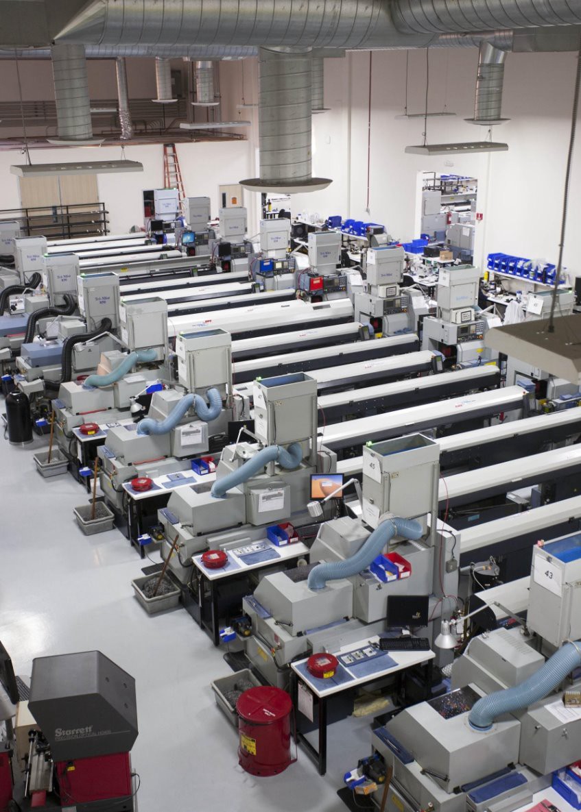Elevated view of CNC machines and workstations on the manufacturing floor